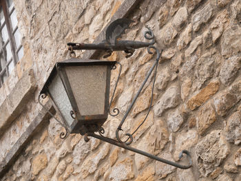 Low angle view of old machinery on wall