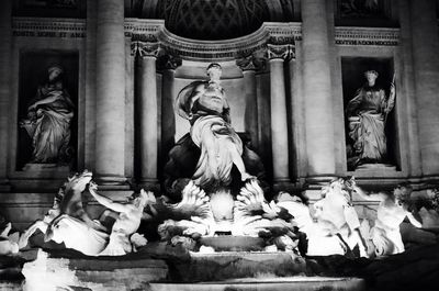 Statue against historic building