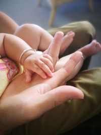 Close-up of hands of mother and child