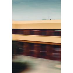 Blurred motion of train at railroad station