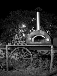 View of rusty wheel on field