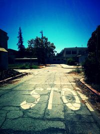 Road in town against clear sky