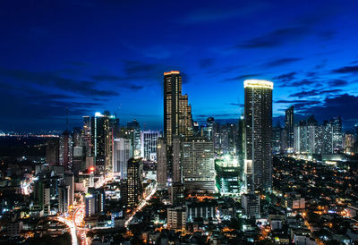 Aerial view of city lit up at night