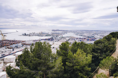 High angle view of trees and buildings against sky