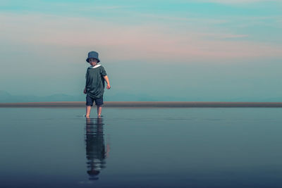 Child walking through water