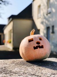 Close-up of pumpkin against building