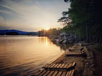 Scenic view of lake against sky during sunset