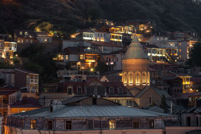 High angle view of illuminated buildings at night