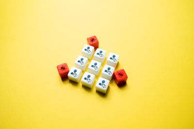 Close-up of dices on yellow background