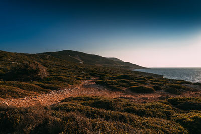 Scenic view of sea against clear blue sky