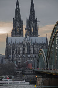 Hohenzollern bridge over river against cologne cathedral