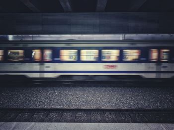 Blurred motion of train at railroad station at night