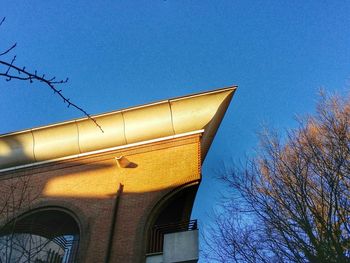 Low angle view of built structure against blue sky