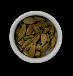 Directly above shot of pasta in bowl against black background