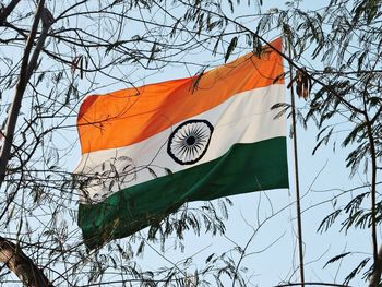 Low angle view of flag against sky