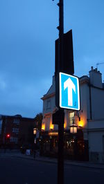 Low angle view of illuminated street light against blue sky