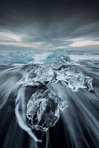 Scenic view of frozen sea against sky