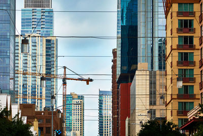 Low angle view of modern buildings in city