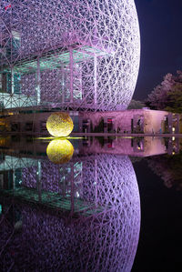 View of illuminated building against sky at night