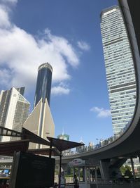 Low angle view of modern buildings against sky in city