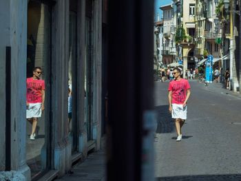 View of woman walking on wall