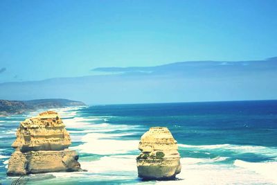 Scenic view of sea against blue sky