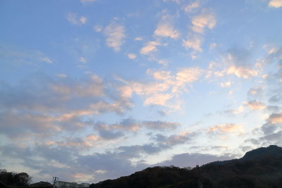 Low angle view of silhouette mountain against sky