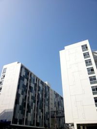 Low angle view of buildings against clear sky