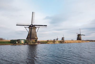 Traditional windmill against sky