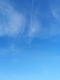 Low angle view of vapor trails in sky