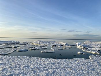 Scenic view of sea against sky during winter