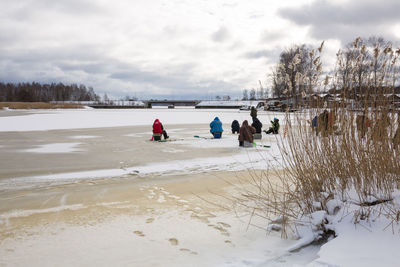 Scenic view of beach against sky during winter
