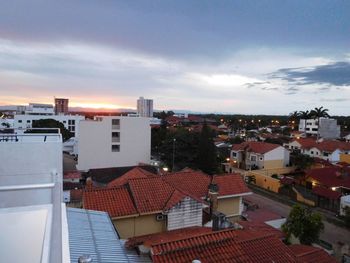 High angle view of residential district against cloudy sky