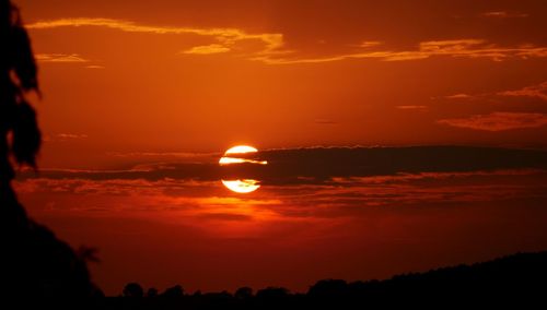 Scenic view of sea against orange sky