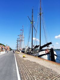 View of harbor against blue sky