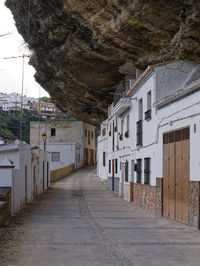 Empty alley amidst buildings in town