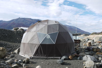 Tent on mountain against sky