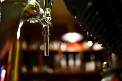 Spout for draft beer in a dark pub