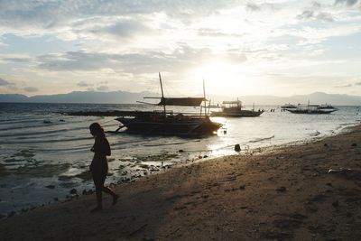 Scenic view of beach against sky during sunset