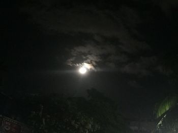 Low angle view of moon in sky at night