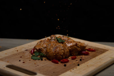 Close-up of meat on cutting board