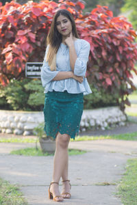 Portrait of young woman standing outdoors