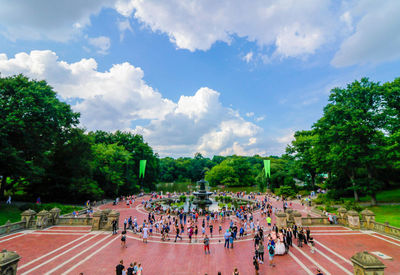 High angle view of people by plants against sky