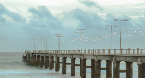 Pier over sea against sky