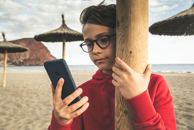 Portrait of mid adult man using mobile phone