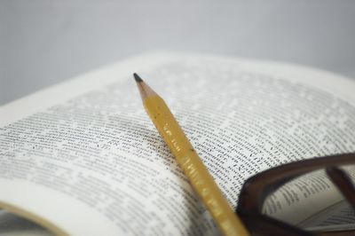 High angle view of pen on book