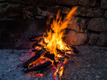 Bonfire on log at night