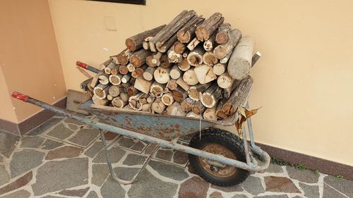 Stack of logs against wall