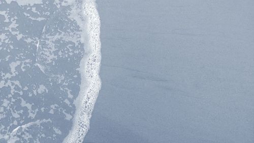 Close-up of icicles on snow covered land
