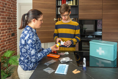Portrait of siblings playing on table
